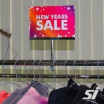 Apparel rack sign holder