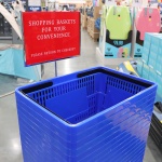 Shopping basket holder with sign