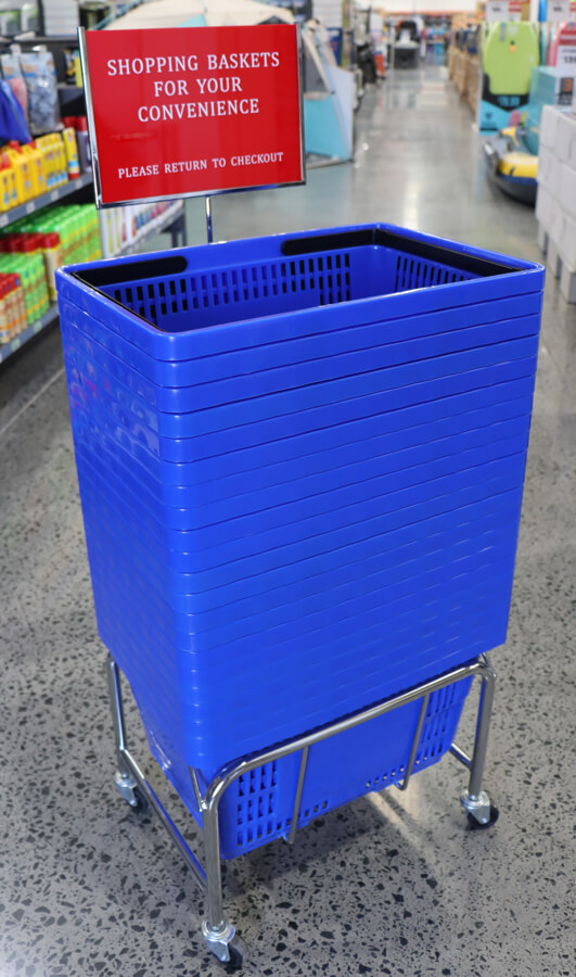 Shopping basket stand with sign at brisbane store entrance