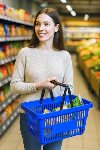 Customer carrying a durable handheld shopping basket in a bright Australian retail store